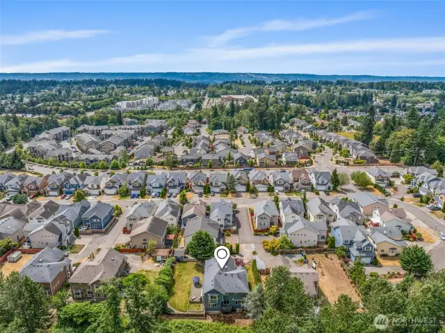 This drone view highlights the generous yard and peaceful surroundings.
