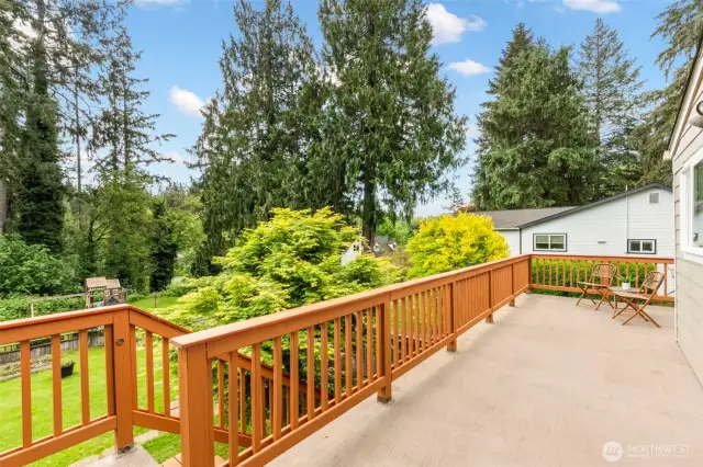 Stairs leading into fenced portion of the backyard.