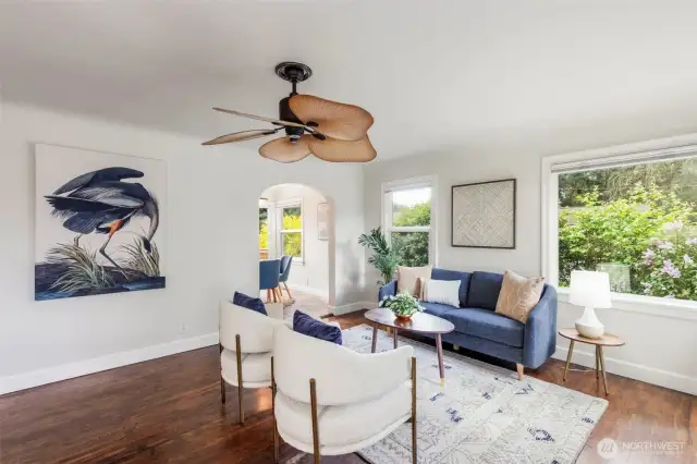Open living room with bay windows for great natural light.