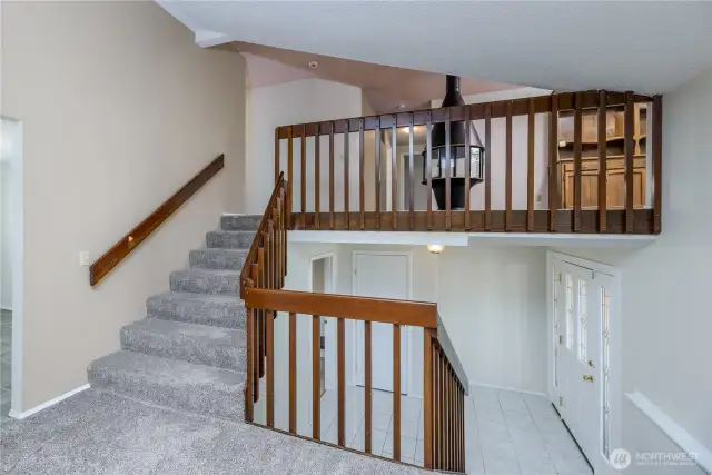 Main entry(below) with stairs to main and upstairs