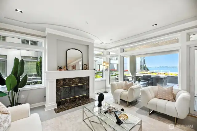 A stylish and elegant living room with western views of Lake Washington and beyond.