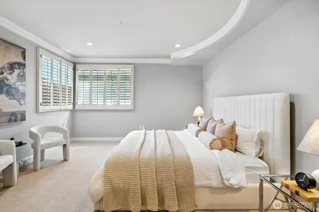 This exquisite main suite offers an abundance of space, allowing for ultimate relaxation and rejuvenation after a long day of exploring or working, providing a truly luxurious and comfortable retreat.