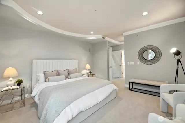 Luxurious main suite with double door entry. This description highlights the high-end features and grand entrance of the main bedroom suite.