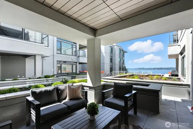 Comfortable outdoor living space with gorgeous views toward Seattle, featuring all-new landscaping.