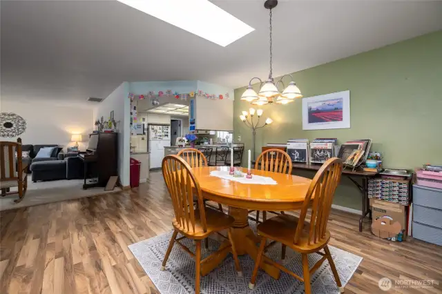 In the dining room, looking toward the living room and kitchen