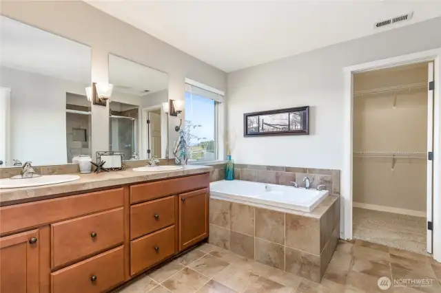 Private 5-piece primary bathroom with walk-in closet