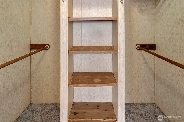 Walk-in closet with built-ins.