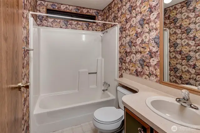 Guest bathroom with shower.
