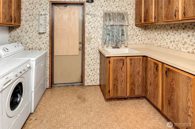 Separate laundry room and utility room.