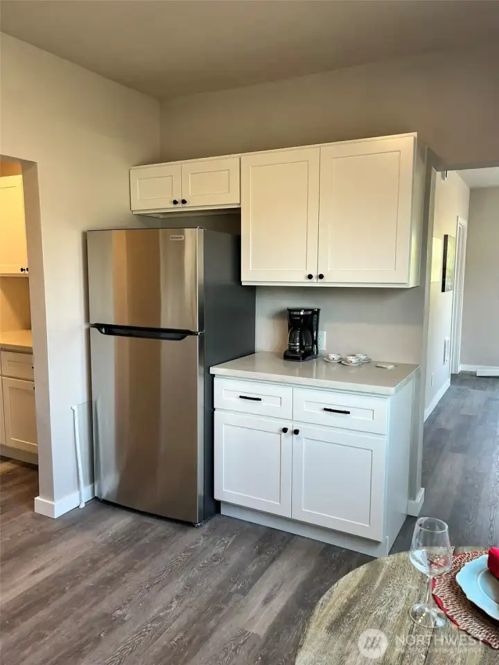 Fridge and entry to more storage.