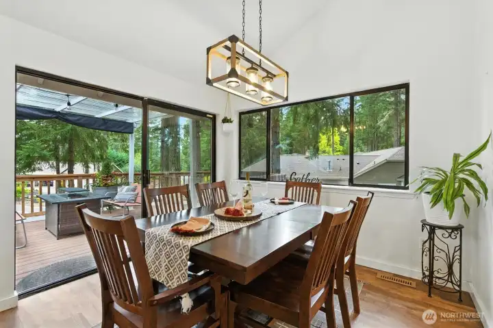 Al fresco dining with slider to covered front deck for BBQs and relaxation entertaining