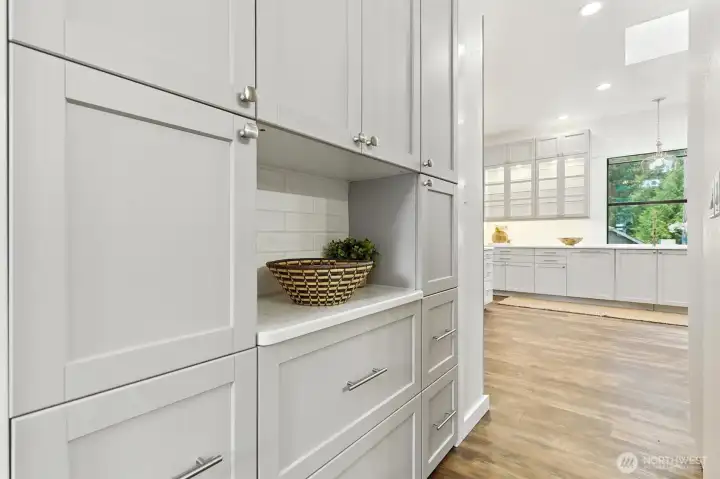 Dry bar area and extra cabinets for entertaining supplies