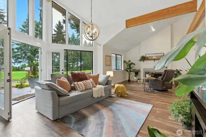 Living room #2 with another fireplace and access to the BRAND new back deck and golf course