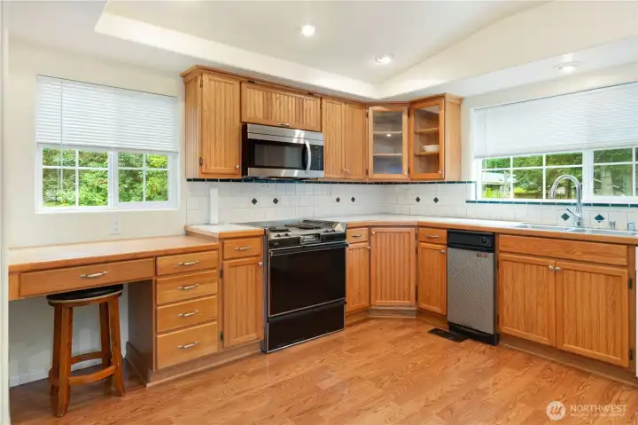 Spacious kitchen has a built-in desk.