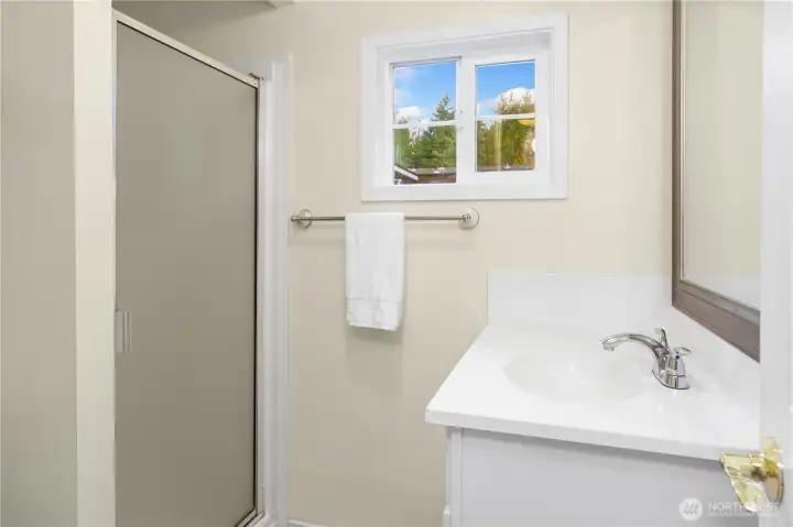 Hall bath features a walk-in shower.