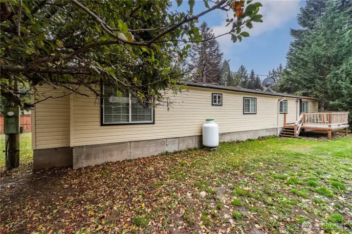 This side of the house shows the 3rd deck which is off of the kitchen and a great place to have your morning coffee.
