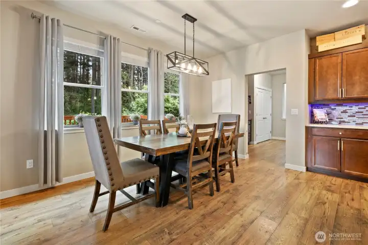 Large dinning room with views of back yard