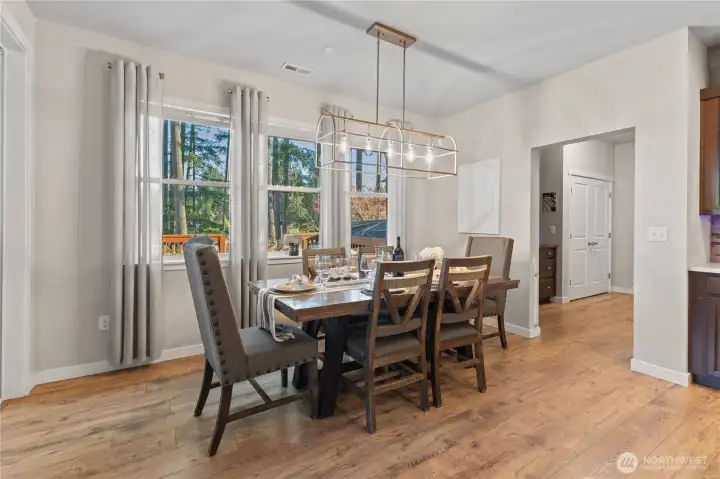 Large dinning room with views of back yard
