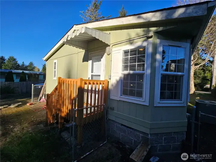 Great light from the many windows into the kitchen area near the back stairs.