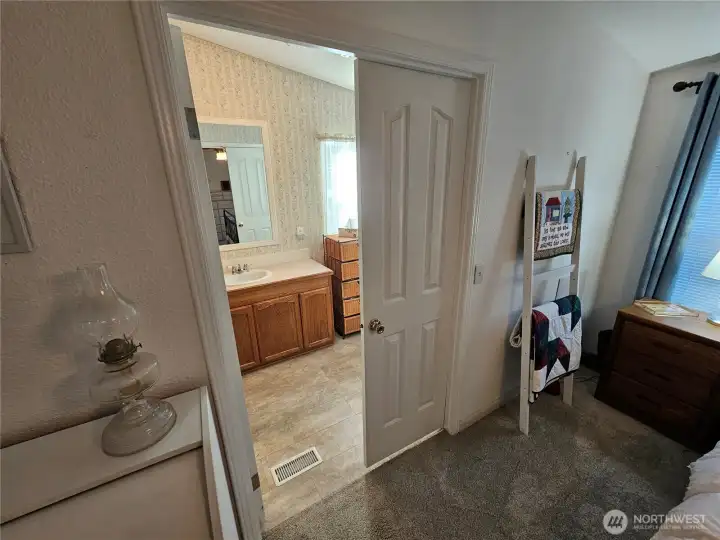 Double doors to the en-suite bathroom.