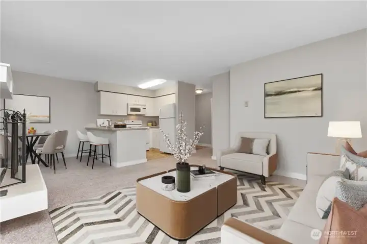 Digitally staged photo of living, dining, and kitchen area.