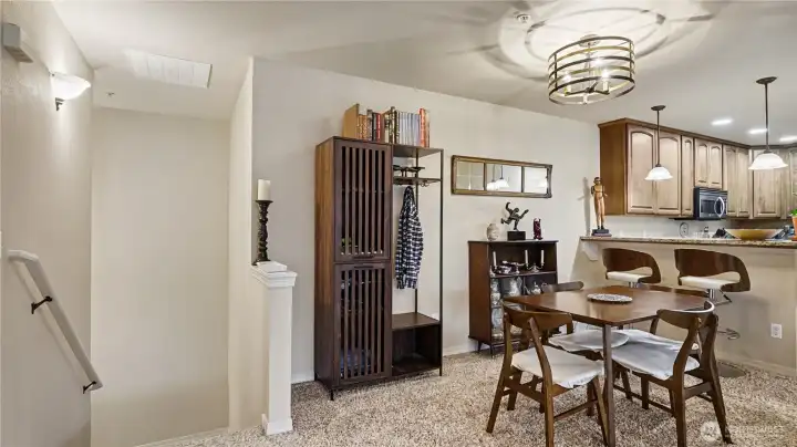 The open floor plan creates an inviting atmosphere, highlighted by a cozy fireplace in the living room—perfect for relaxing evenings at home.