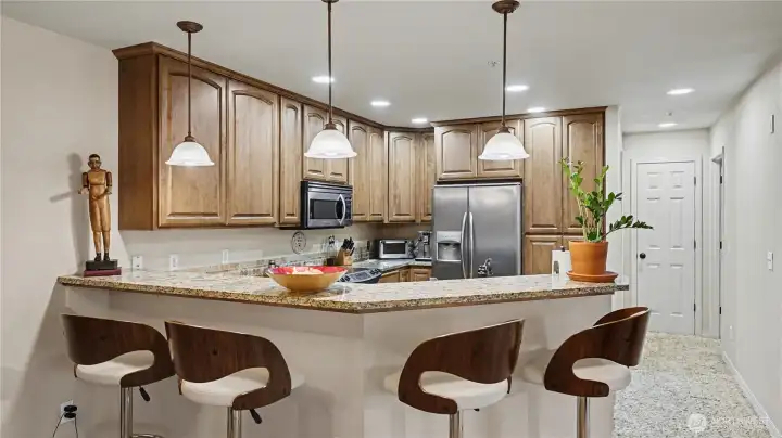 Bar-top seating offers the perfect spot for casual meals or morning coffee.