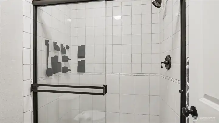 Separate water closet houses the shower and toilet.