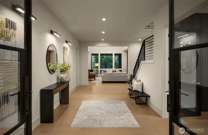 Commanding entryway with double iron and glass doors
