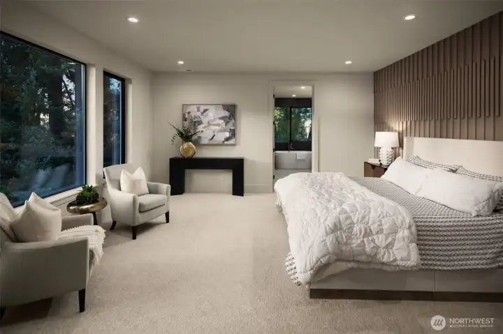Large primary suite with custom accent wall