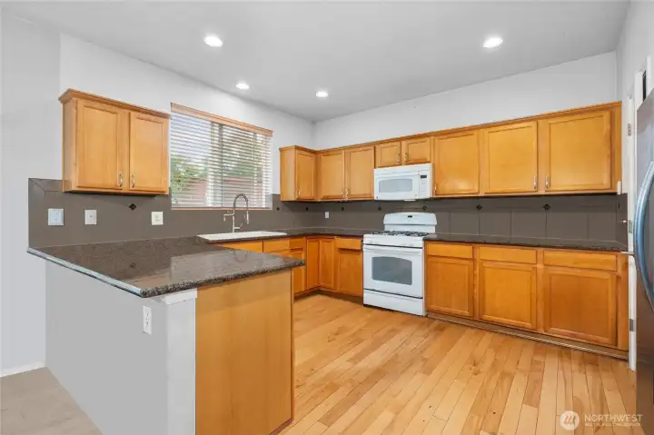 Spacious Kitchen with Granite Counters,  Photoshopped to remove personal items still in the home