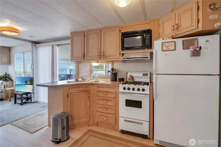 Efficient kitchen layout provides ample space for preparing meals before a day on the golf course, lake, or trails.