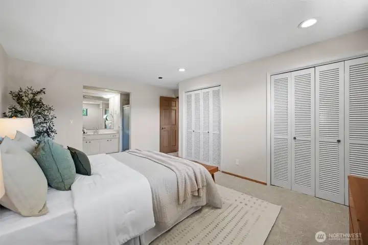 Primary suite includes an en-suite bath and double closets.