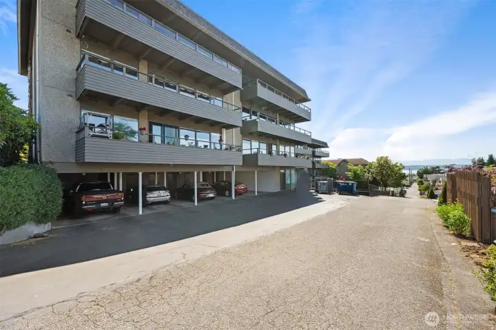 Covered and assigned parking space with guest parking down below and easy access to elevator.