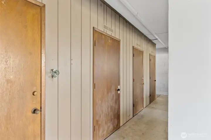 The storage closet has a work bench, cabinets, and power.