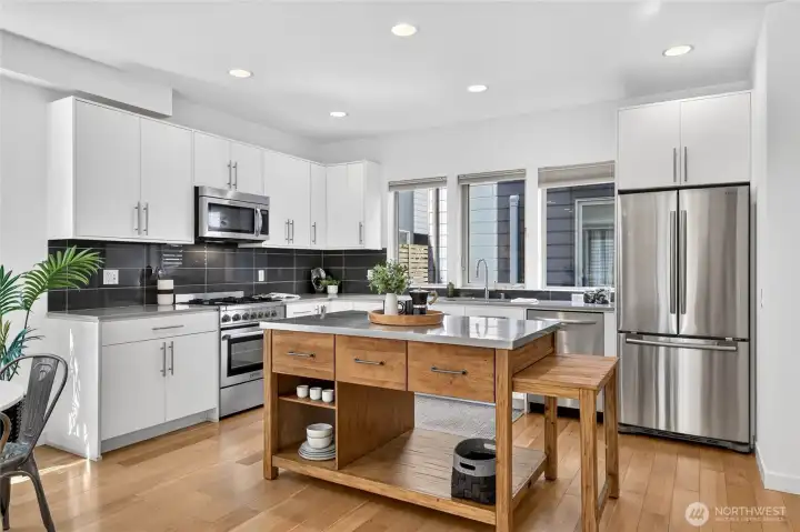 Stainless steel appliances, gas cooking and plenty of storage and prep space.
