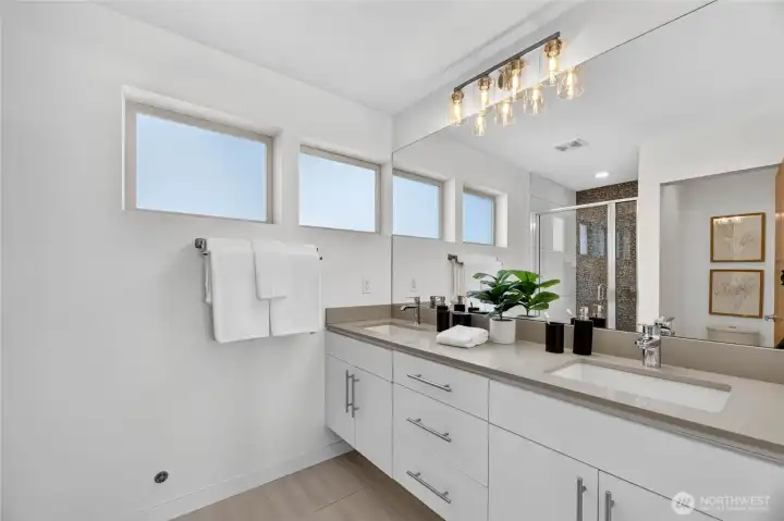 Primary ensuite with double vanity.