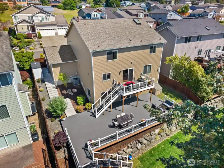 Multi tiered deck w/poured concrete steps to access lower level. Would make perfect MIL or guest suite.