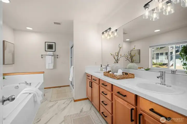 Fresh bath w/new floor, lighting and Miracle method treatment on existing tile.