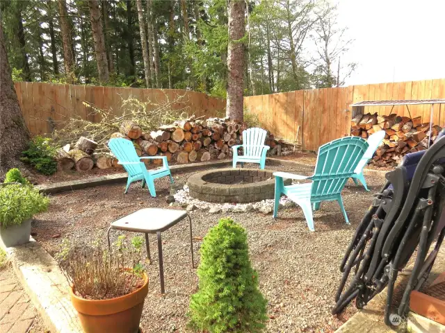 IN THE BACK YARD IS A GRAVELED FIRE PIT WITH CHAIRS TO ROAST MARSHMALLOWS AND HOT DOGS OR RELAX AROUND A CAMP FIRE!