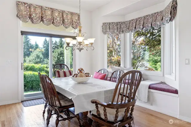 Casual dining between Family Room and Kitchen - slider to well sized covered patio.