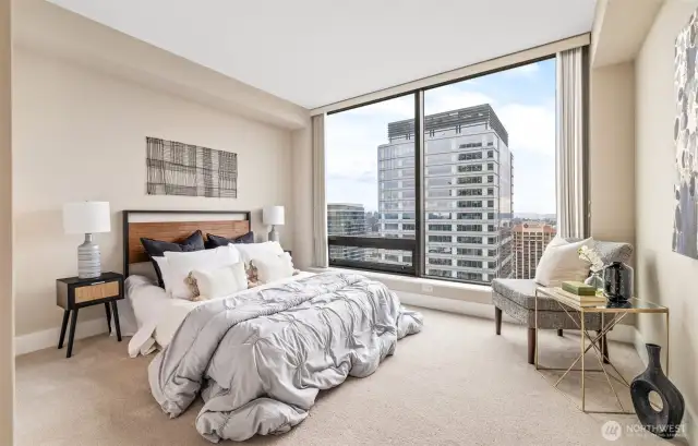 Primary bedroom with a stunning city view