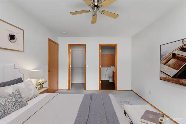 Primary bedroom virtually staged featuring a walk-in closet