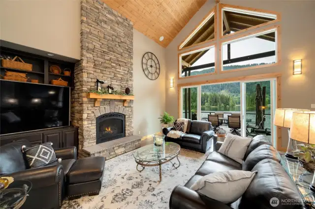Enjoy the views from your large great with with floor to ceiling windows and vaulted wood ceilings.