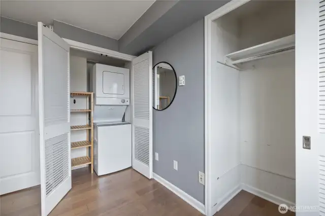 Closet storage plus stacked washer and dryer with additional storage space