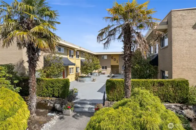 Nicely landscaped surround of building, surrounded by lovely neighborhood of homes