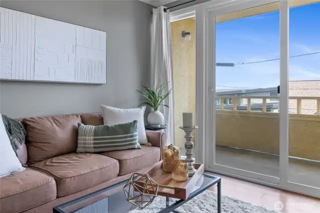 Updated sliding patio door, and private balcony with peekaboo views to Commencement Bay