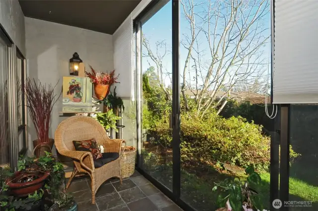 Quiet, private sunroom captures the morning sun. Notice the blinds which completely close off the space for privacy. Archive photo.