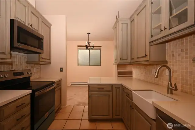 The kitchen has ample cabinets and silstone counter space.  There is under-cabinet lighting.