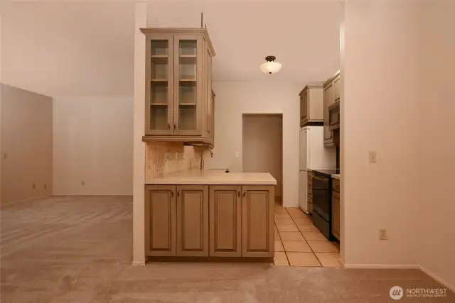 Un-staged photo from dining room looking into the kitchen.